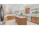 Spacious open concept kitchen with a large island, stainless steel appliances, and breakfast nook at 3166 E Desert Willow Rd, Phoenix, AZ 85048
