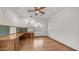 Bright home office with built-in desk, wood floors, and arched windows, perfect for productivity and style at 3166 E Desert Willow Rd, Phoenix, AZ 85048