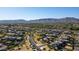 Picturesque aerial view showcasing a Gathering-friendly community with green spaces and attractive homes nestled near mountains at 3319 W Carter Rd, Phoenix, AZ 85041