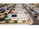 Aerial view showcasing a home with a private pool and solar panels in a residential neighborhood at 3319 W Carter Rd, Phoenix, AZ 85041