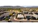 Attractive aerial view of homes with desert landscaping and solar panels set against a backdrop of scenic mountain views at 3319 W Carter Rd, Phoenix, AZ 85041