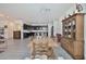 Open floor plan with dining area looking into a modern kitchen at 3319 W Carter Rd, Phoenix, AZ 85041