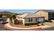 Charming single-story home featuring a well-manicured front yard, an attached garage, and solar panels on the roof at 3319 W Carter Rd, Phoenix, AZ 85041