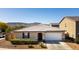 Charming single-story home featuring a two-car garage, desert landscaping, and a beautiful mountain view at 3319 W Carter Rd, Phoenix, AZ 85041