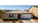 Charming single-story home featuring a two-car garage, desert landscaping, and a beautiful mountain view at 3319 W Carter Rd, Phoenix, AZ 85041