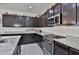 Modern kitchen showcasing stainless steel appliances, granite countertops, and stylish cabinetry at 3319 W Carter Rd, Phoenix, AZ 85041