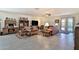 Spacious living room featuring tile flooring, neutral walls, and comfortable leather furniture at 3319 W Carter Rd, Phoenix, AZ 85041