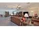 Spacious living area featuring tile flooring, recessed lighting, and comfortable leather furnishings at 3319 W Carter Rd, Phoenix, AZ 85041