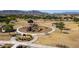 Aerial shot of a neighborhood park featuring a playground, covered picnic area, and walking paths at 3319 W Carter Rd, Phoenix, AZ 85041