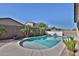 Refreshing pool and landscaped area with lush greenery, and private fencing providing ultimate relaxation at 3319 W Carter Rd, Phoenix, AZ 85041