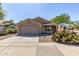 Attractive single-Gathering home with a two car garage and desert landscaping on a clear, sunny day at 3532 S 160Th Ln, Goodyear, AZ 85338