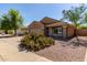 Charming single-story home featuring desert landscaping, a two-car garage and neutral color palette at 3532 S 160Th Ln, Goodyear, AZ 85338