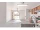 Open kitchen featuring modern appliances, lots of counter space and backyard views from the sink at 3532 S 160Th Ln, Goodyear, AZ 85338