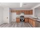 Spacious kitchen with stainless steel appliances, wood cabinets and bright, open floor plan at 3532 S 160Th Ln, Goodyear, AZ 85338