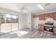 Bright kitchen area featuring wood cabinets, stainless steel appliances and sliding door access to backyard at 3532 S 160Th Ln, Goodyear, AZ 85338