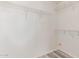Walk-in closet with wire shelving and gray wood-look flooring at 3532 S 160Th Ln, Goodyear, AZ 85338