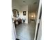 Welcoming foyer with tile flooring leads to the open concept living spaces beyond at 3602 N 300Th Dr, Buckeye, AZ 85396