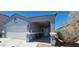 Charming single-story home featuring a covered front porch and attached two-car garage at 3602 N 300Th Dr, Buckeye, AZ 85396