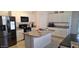 Well-equipped kitchen with granite countertops, stainless steel appliances, and center island at 3602 N 300Th Dr, Buckeye, AZ 85396