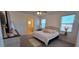 Spacious main bedroom with neutral tones, plush carpeting, and large windows for ample natural light at 3602 N 300Th Dr, Buckeye, AZ 85396