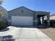 Charming single-story home with a two-car garage, covered porch and desert landscaping at 3602 N 300Th Dr, Buckeye, AZ 85396