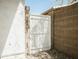 A backyard featuring a white gate between the house and brick wall at 365 E Mountain View Rd, San Tan Valley, AZ 85143