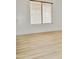 Bright and airy bedroom showcases wood flooring, neutral walls, and a window at 365 E Mountain View Rd, San Tan Valley, AZ 85143