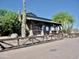 The exterior of building with plants and fence along walking path at 365 E Mountain View Rd, San Tan Valley, AZ 85143