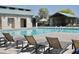 Relaxing community pool with lounge chairs and umbrellas for residents' enjoyment at 365 E Mountain View Rd, San Tan Valley, AZ 85143