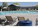 Relaxing community pool with lounge chairs for residents' enjoyment at 365 E Mountain View Rd, San Tan Valley, AZ 85143
