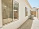 Exterior with windows, siding, and AC unit surrounded by gravel landscaping at 365 E Mountain View Rd, San Tan Valley, AZ 85143