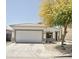 Charming single-story home featuring a two-car garage and a well-maintained front yard with mature tree at 365 E Mountain View Rd, San Tan Valley, AZ 85143