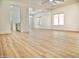 Inviting living space with wood-look floors, white walls, and an open layout perfect for modern living and entertaining at 365 E Mountain View Rd, San Tan Valley, AZ 85143