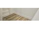 Close-up of walk-in closet flooring and trim detail at 365 E Mountain View Rd, San Tan Valley, AZ 85143