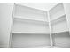 Well-organized walk-in closet with ample shelving, maximizing storage space for clothes and accessories at 365 E Mountain View Rd, San Tan Valley, AZ 85143