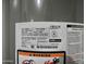 Close-up of water heater label showing the serial number, model number, and safety warnings at 365 E Mountain View Rd, San Tan Valley, AZ 85143
