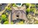 Directly above, a well-maintained roof sits atop a home with desert landscaping, blending luxury and natural beauty at 37308 N 100Th Pl, Scottsdale, AZ 85262