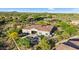 Aerial view shows a residence with a pool, manicured landscaping, and a peaceful neighborhood setting at 37308 N 100Th Pl, Scottsdale, AZ 85262