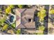 Aerial view of home featuring landscaped backyard with pool, fire pit, and putting green at 37308 N 100Th Pl, Scottsdale, AZ 85262