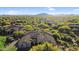 An aerial view showcases a home amidst lush desert landscape, offering privacy and stunning natural beauty at 37308 N 100Th Pl, Scottsdale, AZ 85262