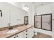 Bright bathroom with dual sinks, granite countertops, and tiled shower and floors provides ample space at 37308 N 100Th Pl, Scottsdale, AZ 85262