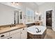 Bathroom features a soaking tub, double vanities, granite countertops and modern fixtures at 37308 N 100Th Pl, Scottsdale, AZ 85262