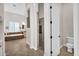 Bathroom view through a doorway with a shower, soaking tub, and double vanity at 37308 N 100Th Pl, Scottsdale, AZ 85262