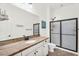 Well-lit bathroom with a single sink, granite countertops, and tiled shower provides a relaxing atmosphere at 37308 N 100Th Pl, Scottsdale, AZ 85262