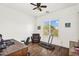 Versatile bedroom/office space with hardwood floors, a desk, chair, and a treadmill at 37308 N 100Th Pl, Scottsdale, AZ 85262