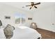 Bright bedroom with a comfortable bed, chair, and window offers ample natural light and a relaxing atmosphere at 37308 N 100Th Pl, Scottsdale, AZ 85262