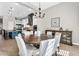 Bright and airy dining room with stylish chandelier and modern furnishings at 37308 N 100Th Pl, Scottsdale, AZ 85262