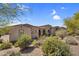 Exterior of home featuring desert landscaping and a private courtyard at 37308 N 100Th Pl, Scottsdale, AZ 85262
