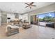 Comfortable living room features large sectional, tile floors, and patio access at 37308 N 100Th Pl, Scottsdale, AZ 85262