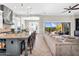 Open floor plan featuring living room connected to chef's kitchen and outdoor patio at 37308 N 100Th Pl, Scottsdale, AZ 85262